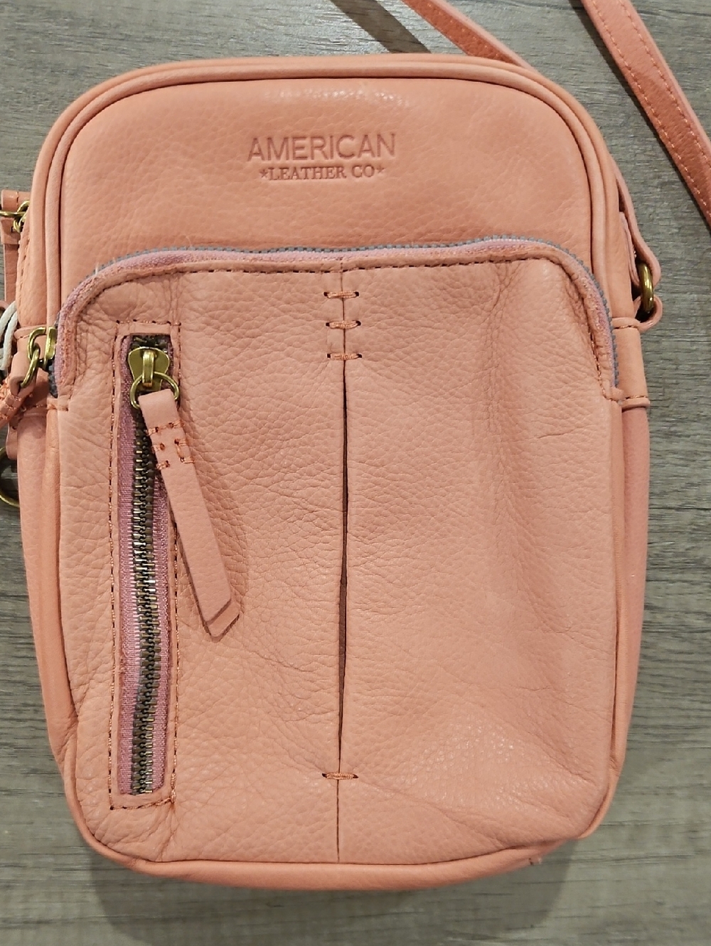 American Leather Co. pink salmon cross body bag